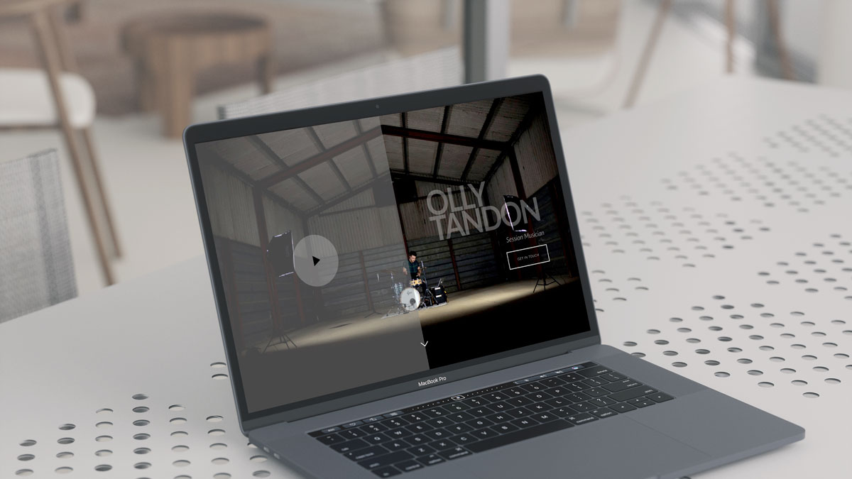 Olly Tandon Music website open on a MacBook Pro.